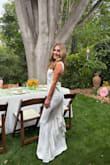 I wore this to my bridal shower and received amazing feedback from everyone there! The dress is very flattering on and offers a little stretch room. I got an XS and it fitted pretty true to size. For the shorter girls -- it was a tad long on me (I am 5'2) but just had to wear higher heals with it! Truly was a great dress and I am glad I picked it! - Nicole