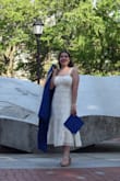 The dress fit well and looked great in my grad photos! I definitely suggest a skin-tone base layer on the bottom, but I wore a white bra and it wasn't noticeable. Love the dress! - Jessica W.