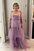 I could actually see my belly button through this dress. The ruffles are too sheer and you totally see the liner. Also couldn't zip it up. Way too long and it's just not for me. - Jody L.