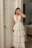 This dress is extremely flattering! I absolutely love the fit of the dress and love the low cut in the front. The color is more cream than full on white but I am so excited to wear this for my engagement shoot. - Jaritza C.