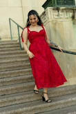 I love this dress! I wore it for my graduation photoshoot and my graduation, and I got so many compliments! It's stretchy around the upper back area, which was nice and made it more comfortable for such long days. Having straps that you could untie and retighten to your liking is also a plus. My only issue was the zipper, which always caught in the mid back when the fabric switched. That was annoying, and I needed a bit of help to get it up. Other than that, I felt so beautiful in this dress and I loved it so much!! - Alex C.