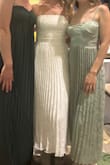 I loved this dress; it was so comfortable, the pleats were so fun on the dance floor, and it was flattering! The top didn't budge too. I wore this to my reception at my wedding! Loved it! - Reba V.