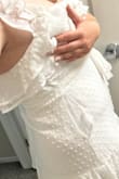 The lace material on the top is very fragile and will rip instantly if you try to do anything besides stand in it. I ordered the size that all of my measurements were in, but the lace on top has no give. Both the bust section and the mid section ripped open after moving around for grad photos for an hour. I would not recommend getting this dress unless you will only be standing (not sitting) with it. - Nicole N.