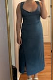 I was very excited for this dress, but the sizing just wasn't right for me. Because it was too large the dress seemed really boxy, didn't hug my curves in a flattering way, and the slit was barely visible. It's extremely stretchy, so I would recommend sizing down if you think you're between sizes, especially if you don't have a large bust. The top was way too loose for me to wear it, and also very, very long for my height. I would say you have to be fairly tall or wear platform heels for this dress to look like the model. Overall, I wasn't a fan of how this looked to me - Erin M.