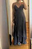 Overall, I thought this dress had a really pretty silhouette, and I liked the color. It felt a little tight in the ribs for me, but I feel like a larger size would have me swimming in the material. The slit is only visible with intentional leg placement for me. It was also just too long. With high heels, it might have just barely been the right length, but I was tripping while trying it on. The straps and ties for this dress were also extremely difficult to put on alone, and I ended up needing help just to get in. For a taller person, this may be perfect, but I found it too difficult to put on for it to become a go-to dress for me - Erin M.
