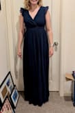 The dress itself is very beautiful, but it fits me boxy. The sleeves were too big and fell off my shoulders, even with rubber on them to keep them up, while the armpit was SO high that it was uncomfortable. The material is polyester or whatever, so it's comfy but just kind of did nothing for me. :/ disappointed because the dress had a lot of promise. - Jadyn K.