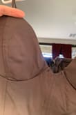 I am very disappointed. This dress came with a stain on the boob area and oddly stretched in certain places on the front below the waist. It makes me wonder if they sent me someone else's returned item. The stitching in the front middle of the chest area looked sloppy, and there were threads sticking out. This is my first Lulus order, and I was really disappointed. This dress fits snug for sure, even through the thigh area, so take that into account for walking purposes, there is very little "give" it's a compression material almost. This has to go back, while washable, I'm not taking the risk with the stain or the weird stretchy marks not improving after a wash. Also, the cup size is smaller than it looks. - Melanie T.