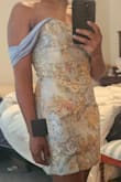 The dress was not smooth in the front near the split, poor seam work, maybe? The hip area was extra wide on me. The bust was also larger than expected. I should have gone down a size, but the front not being smooth swayed my decision not to exchange for a smaller size. - Tasha L.