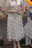 I purchased medium size for my Bridal Shower. The V neck is very deep so if you have big boobs they're going to show.
Luckily, I have small ones, and the Bride To Be sash helped me cover that area. It accentuates the waist and is comfortable to move around. - Marylin M.