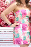 I loved this dress, even better in person! I wore it to The Oaks. It was a little loose in the top but I never felt like it was going to come off (it has elastic at the top only). The fabric was great quality like always! - Chelsea M.