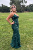 This dress is beautiful! The rich green color is beautiful, and it has the right amount of details. It was a hit with my daughter. - Megan M.
