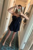 Based of Lulus sizing, I ordered a small but could barely zip up the back. I wanted to exchange for a medium, but that wasn't available at the time, so I tried the large. I'm not sure I'd have been able to zip up the medium either! I do have a larger bust, so if a smaller bust you could probably use a smaller size. I was worried the large would be too much material, but it still looks really cute on! Could dress it up or down. - Natasha T.