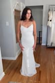 This was a top contender for a long time. Decided to pick another. It was so nice to be able to adjust size with straps in the back. The white was a clean, pure white! Definitely the most comfortable dress I tried on while shopping for my wedding dress! - Steph K.