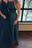 I wore this to a winter wedding. The fabric has a luxurious sheen and is lined. The high neck and open back flattered my small chest. Easy to dance the night away! Though I did need heels otherwise it dragged. - Crystal L.