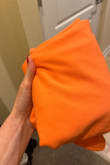 The dress itself is super cute! I ordered it in orange for a bachelorette party. The color on the website is a soft orange but the dress I received is like a Cheeto orange. Very disappointed since the dress is really cute but the color on the website is very misleading. Quality is also not amazing. It's pulling in the back by the zipper and there's excess fabric by the seam on the front of the dress which shouldn't be there - it should lay flat. Will be returning. - Chelsea T.
