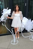 I bought it for the white party. Very charming dress and very elegent!
It's a liitle loose around bust area but I wouldn't change the size (got size S). And watch out for the hem of the dress. It flies up in a strong wind. - Anastasia M.