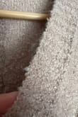 Unfortunately, I took the tags off the sweater, so according to the tags that was attached to it, I can't return it! 
I only wore it for half an hour and it already has a snag. Maybe it was already there before I got it? But the material is so soft and gentle that if you touch it, it snags&.I don't think it's a good product. It's cute, though & runs large. - Sara K.