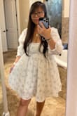 The dress is really cute! I love the style. I would personally prefer a slightly more covered neckline, but it's still a lovely dress. - Shuang W.