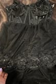 This dress is very beautiful, but on the one I received, the seam line of the first layer of tulle has been either altered or is a manufacturer error because it is in the ver front of the dress and it curves. Also, that same first tier of tulle sits puffier than the rest which interrupts the flow. I don't know if I just got one that was messed up or if they're all like this. - Lena O.