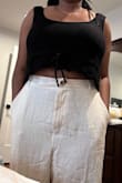 I love it. It's a simple black crop. I paired it with the same pants and necklace as the model. Everything is from Lulus! Love the entire outfit. I'm wearing an XL for my bust. - Christine N.