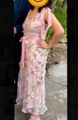 Ordered this dress to wear as a wedding guest and received so many compliments. The floral detailing (particularly the sewn on flowers) and satin ties made it such a lovely dress to wear for a spring wedding, even in Florida heat, and the overall fit was absolutely perfect; as a petite size, things are usually too long or short, but this fit just right. The waistline was slightly higher than preferred due to having a larger bust than the model, so the ribbon around the waist didn't hide the seam between well between the bodice and skirt well, but that wasn't a deal breaker. The inner lining fabric in the bodice area was sewn on unevenly, so it created a few creases in that area that prevented a smooth finished look. It wasn't enough to warrant the hassle of an exchange.
Overall, very pleased with my purchase, even with the slight flaws. I got it on sale for an exceptional price, and it arrived just in time for the event. - Rebecca C.