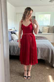 Cute dress with ruffles, bow straps, and a flattering neckline. The zipper is a little difficult to use; however, for the sale price, I was happy with this dress for my sister's "garden party" summer wedding! - Cheyanna J.