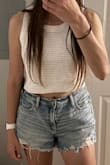 I love the material, and this top is so high quality. It's definitely shorter than I would like, but it's so cute that I'm keeping it. I'm also not going larger because I think it would just make it look boxy. I love that this can be worn with jeans, float pants, or a cute skirt! - Regina R.