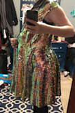 I ordered a medium and the dress literally hangs off me, it's huge and it seems like there's just a lot of extra material in the skirt part that just bunches together, sequins falling off of it everywhere, very itchy. - Ren O.