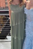 Absolutely gorgeous for prom, loved the color! Wish there was a slit and the bust area does tend to flare out the slightest bit but was still so stunning. - Dory G.