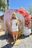 This dress is exactly what you need for your bridal shower or bachelorette! Got so many compliments on it that I also ended up wearing it to the bar after my wedding! No stretch and is a little short but that's why I sized up! I also had some straps put on, but literally so cute - Nicole H.