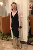 i wore this dress for senior prom and it fit perfectly!! couldn't have loved it more. it was fitted, but also stretchy enough to move in which was nice. just the right length with heels! it was also a nice deep black. the plunge neck hit at just the spot i wanted, and looked fabulous! - Anna G.