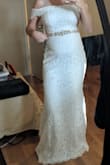 The dress is beautiful! I'd usually be an XS but I am 6 months pregnant, it fit perfectly at around 120 pounds. I also think the sleeves are restricting, I may have the lace sleeves stitched into being a sleeveless dress overall because everything else is perfect. May be because I am a C cup and dress is small as well though.

Overall very pleased! - Elizabeth K.