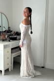 I truly loved how this dress looked on me. It's romantic, bohemian and elegant. The only reason why I did not choose it was because the arms felt a little too tight, and my range of motion was very limited. I was afraid I would not be able to dance like I wanted to at my celebration. But truly gorgeous!! - Claudia V.