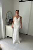 This is the dress I chose for my wedding. I feel it provided everything I liked. It has a beautiful lace corset-like top with a low back and a fitted design. Very comfortable and easy to walk with. Has a short trim which makes it very elegant. - Claudia V.