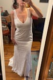 The fit is a bit loose on the top, especially the strap length. The train, length is great, and the lace feels super luxurious. - Anna H.