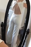 I am so in love with this jumpsuits and completely surprised how well it fits. I look forward to wearing it for my bridal shower and honeymoon. Fits true to size. Good length to be worn with heels, if you plan to wear flats you will probably need to get the pants taken in. Thick material, not see through. Just need to steam it and it'll be ready to go. - Paige K.