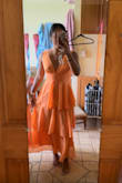 This dress was so pretty when I tried it on. Other reviews are right when they say that it's a little tighter across the rib cage area (where the band of ruching is). It was not bothersome to me, even though I have a wider rib cage. It was definitely snug, but not uncomfortable by any means. Also, if you are shorter like me, the dress will come down lower than it does on the models. Overall, the dress was a top choice for me to wear for a wedding, but I ultimately went with a different one, but not because anything was wrong with this dress! - Alyssa K.