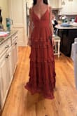 This dress was so pretty and I especially loved the color. the neckline is perfect and not too showy. It's a great dress - Maddy S.