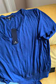 This is a bright royal blue, nothing like the dark blue pictured, and since the return policy changed even though I was under 30 days, couldn't return it. It still has the tags & will never be worn. I've never had a color be this off before - Elizabeth B.
