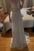 The dress is stunning. I love it, but it does run small, and as I tried it on for the first time, beads began to fall off. I'm scared to try it on again and have more come off. I bought this as a sale item, so I'm unable to return unfortunately - Kia F.