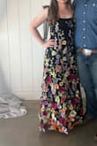 I bought this for a friend's wedding and got so many compliments! The top is fitted but comfortable to move in. Straps are a little flimsy; I was worried about them ripping, but they stayed in good shape all night. Material is good quality, lined, and not itchy. Highly recommend - Emily M.