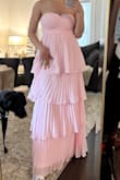 This dress is so beautiful. I love the shade of pink and the flowy tiers. Unfortunately, this dress did not stay in place for me like the other reviews said. I had to pull it up constantly throughout the night. It also bunched a little in the back by the zipper seam. For the price, I wish it had been a bit more functional. Still looked beautiful, just not easy to wear. - Nicole V.