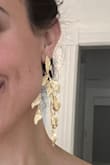 I love these! Big, gold, and dangly earrings are my go-to, and these are definitely that. I wore them for a wedding, but will find many other uses. My only complaint is that the pair I received is a bit asymmetrical, like something went wrong during the manufacturing process for one of them. Not super noticeable, but would definitely ruin the earring if you tried to fix it. Otherwise, love them. - Nicole V.