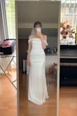 The cut is very flattering, and the dress is elegant! But I personally think the layers at the back seem a bit too busy. And it runs small. I really love how it looks at the front though! - Ke-Chun Y.