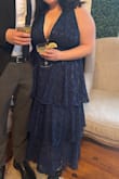 Fit true to size, love the material. I ordered the XXL, and the only issue was the top. I am larger chested and used boob tape for the event. It worked very well, but it was a very chesty dress. - Chandler P.