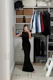 The material is thick (in a good way) and hugs in all the right places. I'm getting the dress hemmed because it's a bit long, but for $100, it's really a steal. A staple black gown to dress up with jewelry. - Josie B.