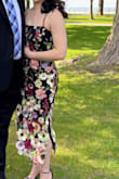 I wanted a unique dress to a wedding I was attending. The bride was aiming for a wild flower type theme and this was perfect. There is no stretch, thick and a bit heavy due to all the fabric and embroidered flowers, and not a lot of shape around the waist. It worked well for me. It was snug around the waist when I first got it, but I guess I lost a little bit of weight by the time the wedding came around that it was perfect. I did wish it had more of a waist shape, but since it had no stretch it was fine to sit and not feel like a sausage. Make sure to tie it tight and double knot or it can slowly become loose; the string is satiny. I received A LOT of compliments on the dress; everyone loved it. I loved it cause it was well made and something very different. Hoping to wear it again. - Annie D.