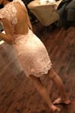 Modest in the front and a little sexy in the back. I bought this for a wedding and it will work both for the Church and the reception!! I usually order an XS but they only had Small, it was a little large on me in the shoulder area and WAY longer than it looks on the model photo so keep that in mind. Overall super cute/sweet dress. - Anna M.