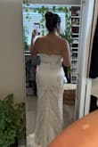 It was a beautiful dress! The bust/back was too tight and didn't zip up. I have a wide back though. The bust also folded over too easily so it would help to have some boning added. I'm really short so I'd have to have many alterations even if it fits in the bust. Waist and hips fit perfectly. I don't think the pictures do it justice though. The lace on top of satin looks way better in person! One thing I didn't like was that the lace in the cleavage area just stops, but this is a personal opinion. - Rebecca M.