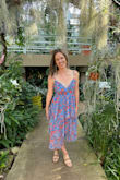 I wore this dress to my friend's "garden party" wedding and it was absolutely perfect. Like other reviewers mentioned, it is tight around the waist/rib cage, but it was not uncomfortable. I think it made the dress look better and would not have wanted it any larger. I have smaller boobs so the top gaped a bit but I fixed that with body tape. This dress was so fun to twirl in! - Amelia M.